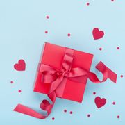 present or gift box, paper heart and confetti on blue background top view valentines day greeting card last minute valentines day gifts