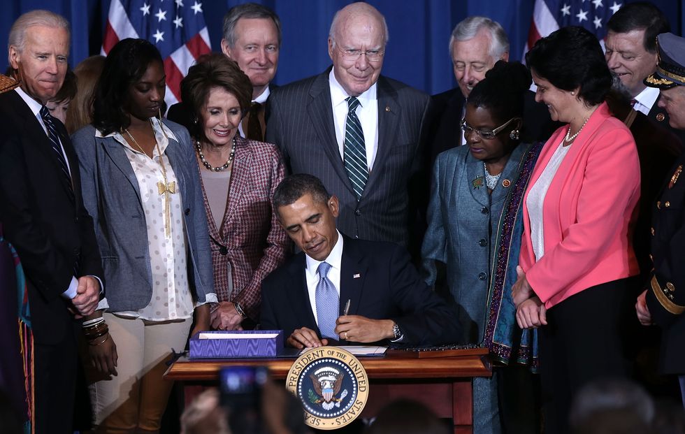 president obama signs the violence against women act