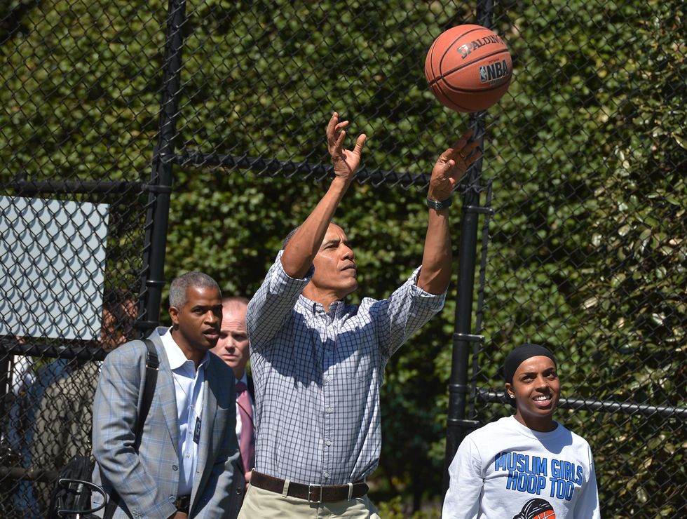 barack obama following through on a basketball shot