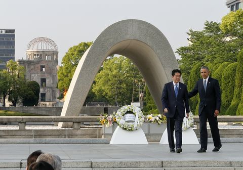 us president barack obama with japanese prime minister shinzo abe after laying a wreath to commemorate the victims of the 1945 atomic bombing at hiroshima peace memorial park