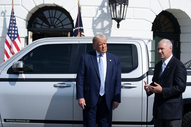 president trump and lordstown motors ceo steve burns talk beside endurance electric pickup truck on south lawn of the white house in 2020