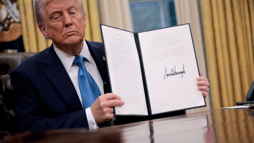 president trump signs executive orders in the oval office