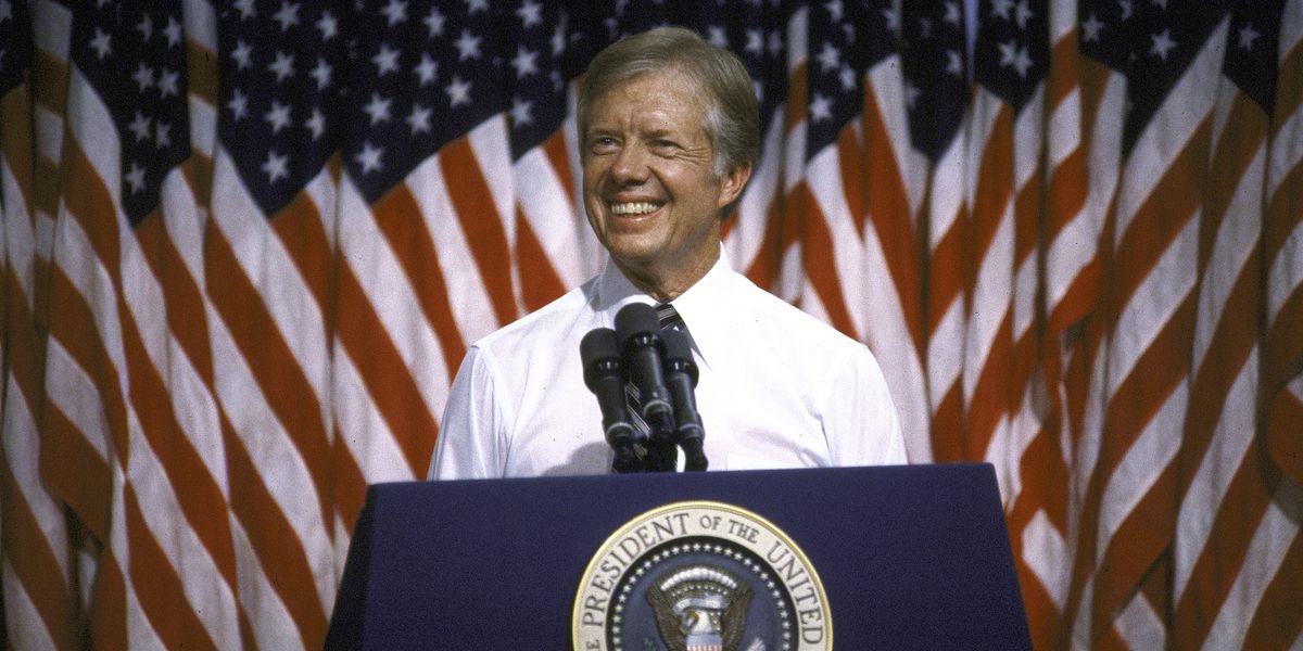 president jimmy carter speaking at podium at merced college