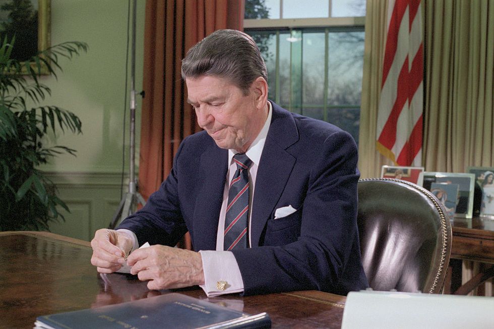 ronald reagan seated in oval office