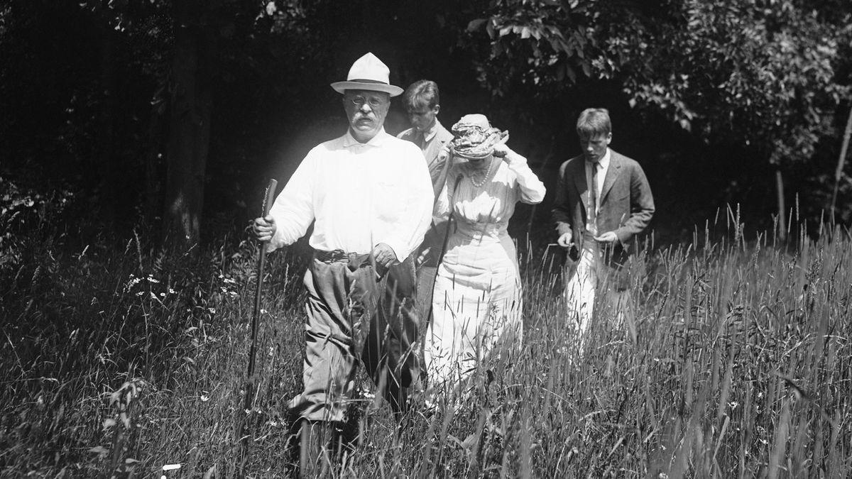 President Theodore Roosevelt hikes with his wife, Edith, and two sons, Teddy Jr. and Kermit, along their Sagamore Hill estate following a boat ride