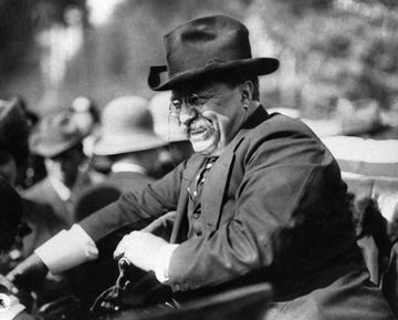 president theodore roosevelt seated in an automobile