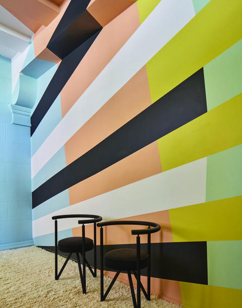 all of the paints on a wall in a horizontal stripe pattern