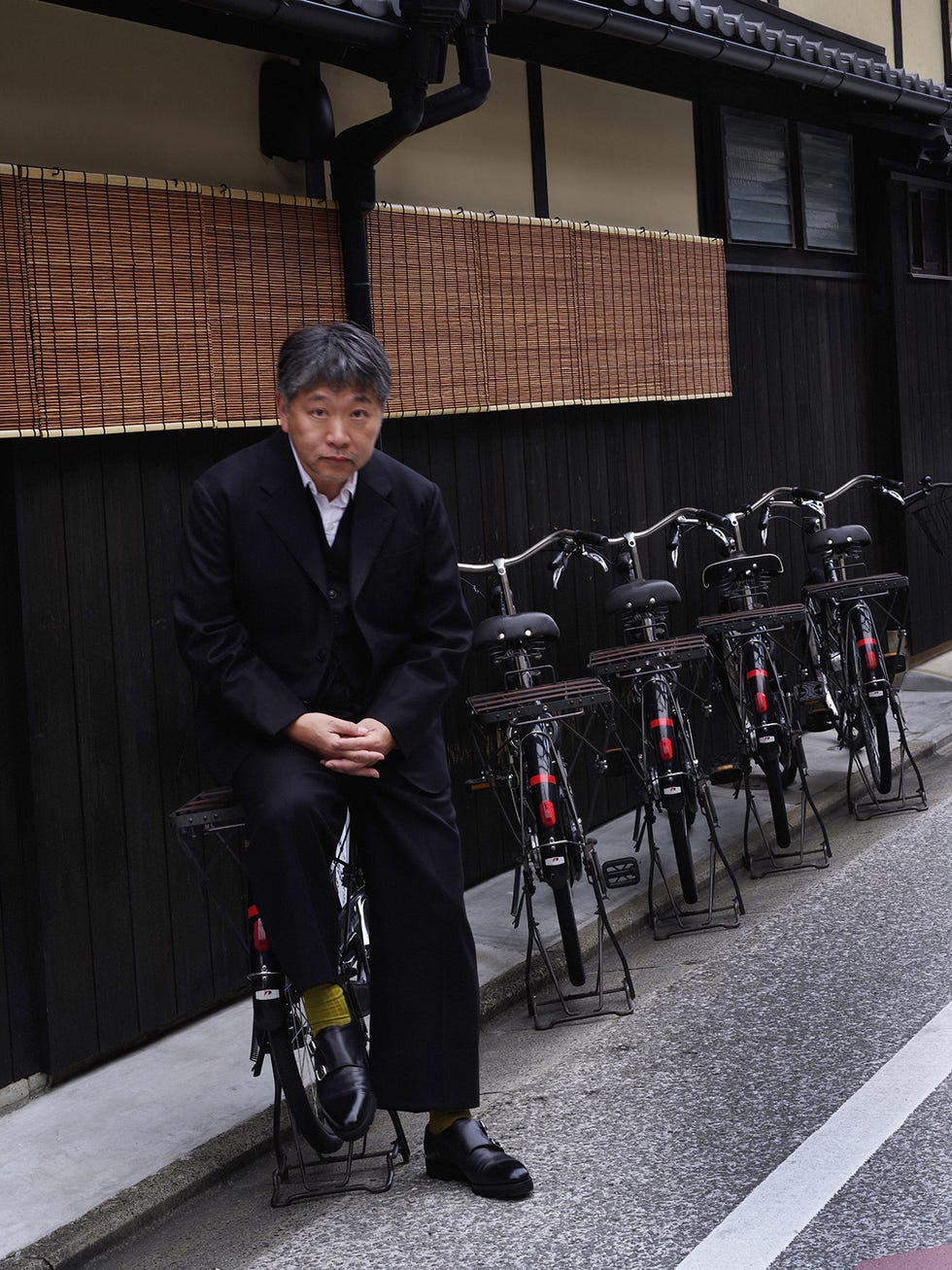 a man sitting on a bicycle