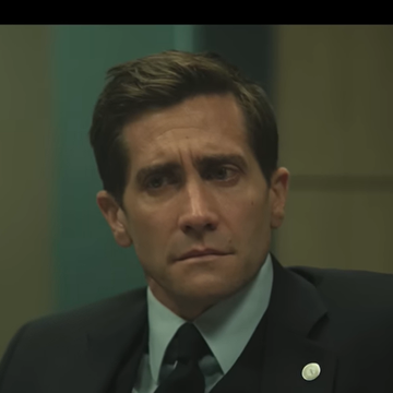 presumed innocent trailer, jake gyllenhaal looks worried while wearing a suit