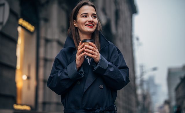 pretty girl holding coffee cup