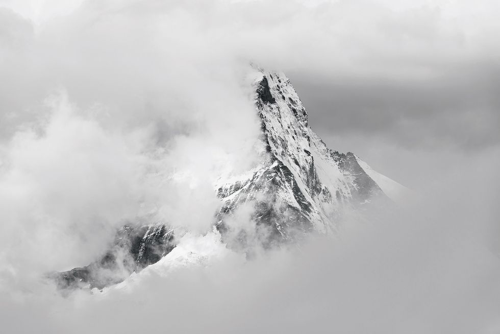 Switzerland, Valais, Zermatt, Matterhorn mountain seen through clouds