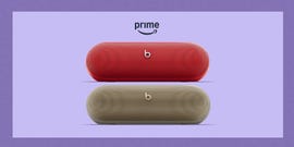 two portable bluetooth speakers in red and beige with prime text above