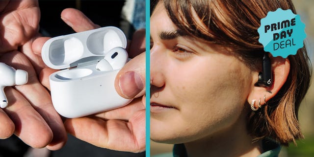 wireless earbuds in a charging case held in hands