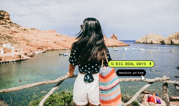 a person standing on a dock looking at a body of water
