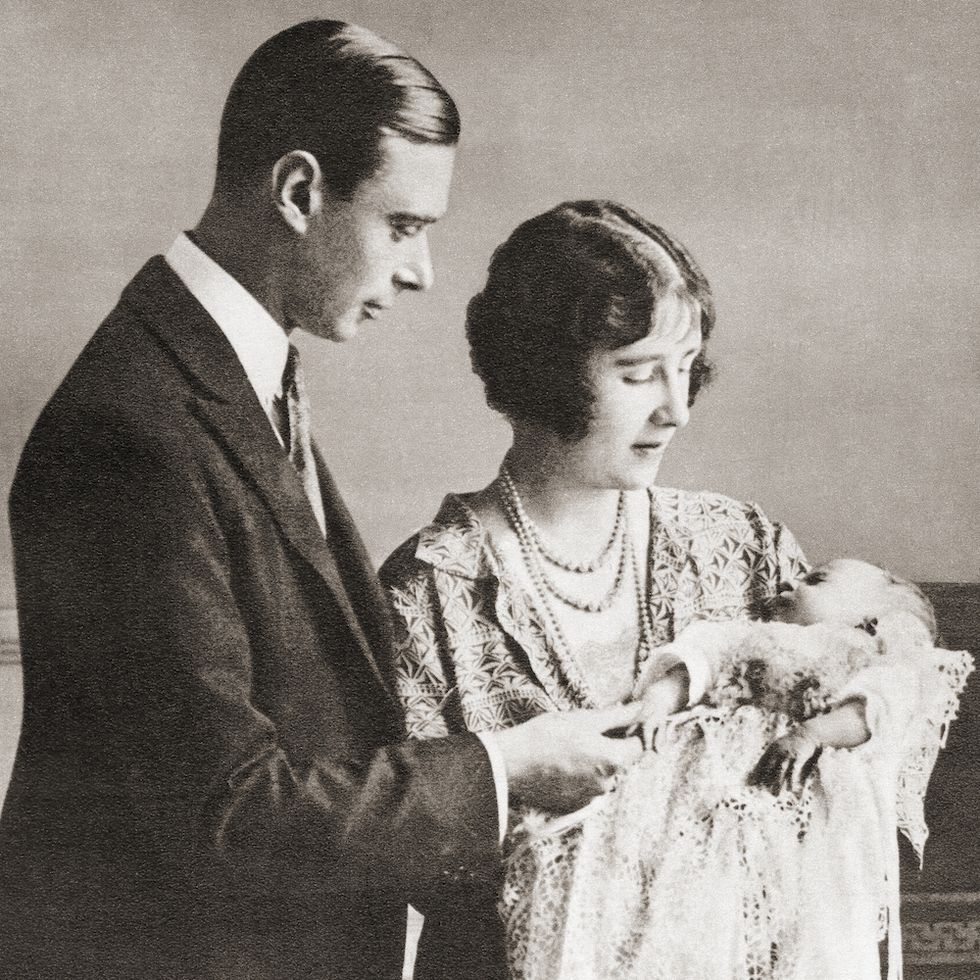 Prince Albert and Elizabeth Bowes-Lyon hold baby daughter Elizabeth.