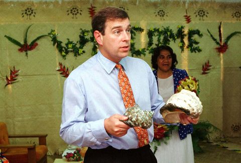 HRH Prince Andrew examines some clam shells at the
