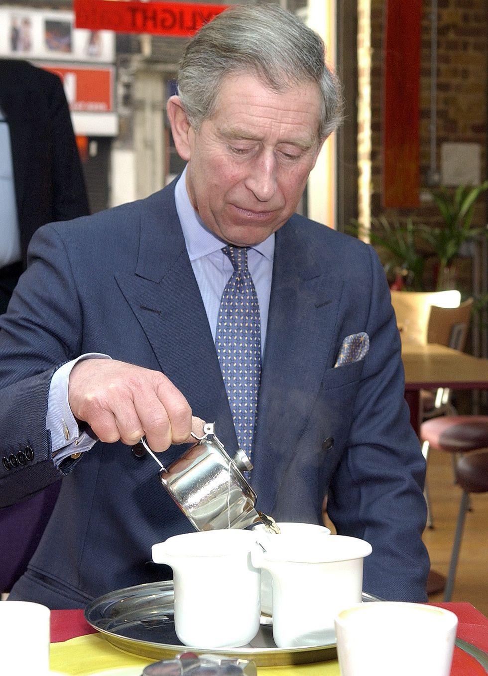 charles pouring tea