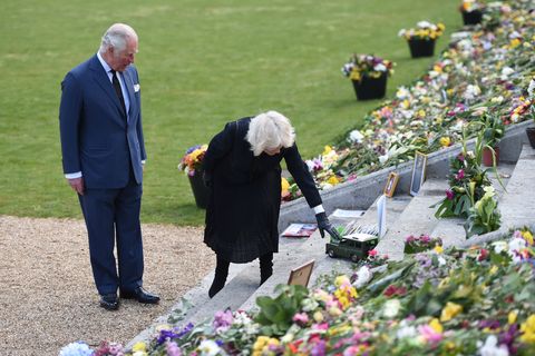 the prince of wales and the duchess of cornwall view tributes left by members of the public following the death of the duke of edinburgh