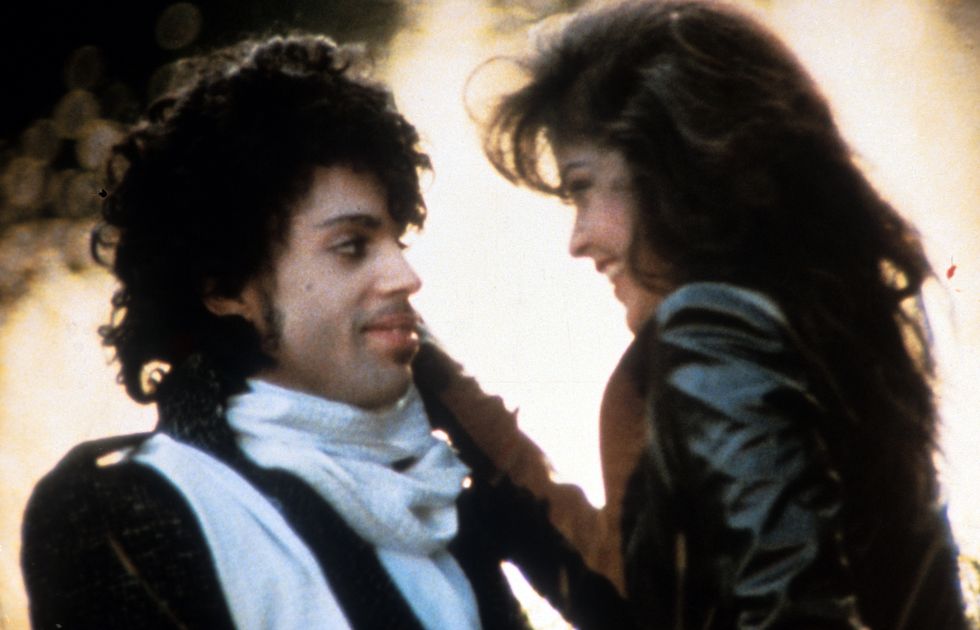 Prince embraces Apollonia Kotero in a scene from the film 'Purple Rain'