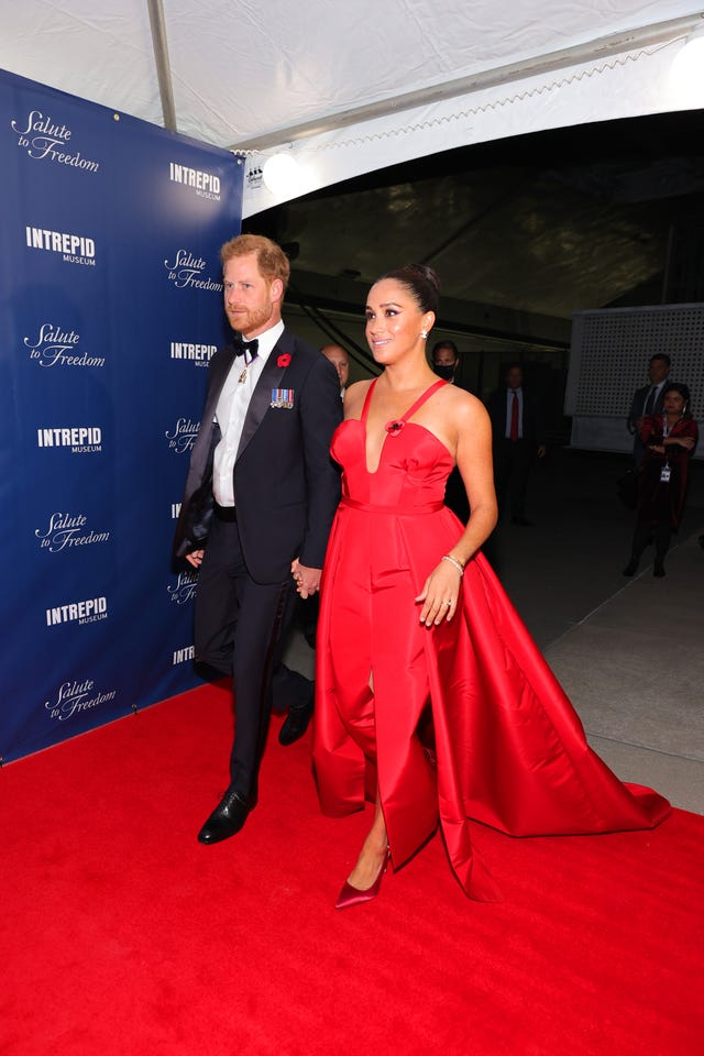 Meghan Markle Wears a Bold Red Caroline Herrera Dress. See Photos Here.