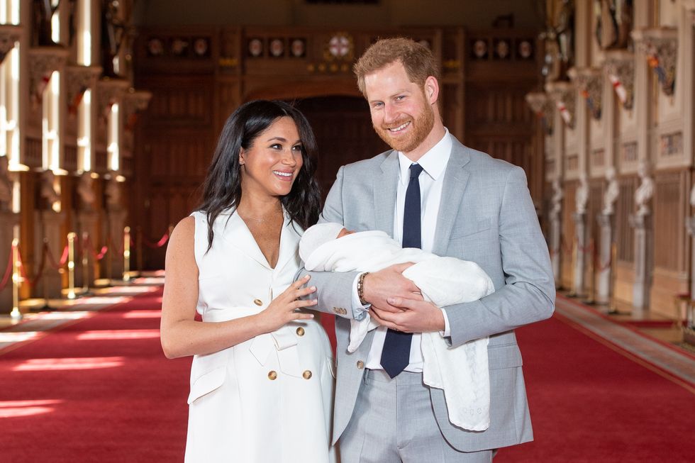 the duke and duchess of sussex pose with their newborn son archie