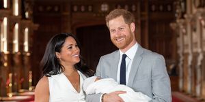 prince harry holding son archie with meghan markle
