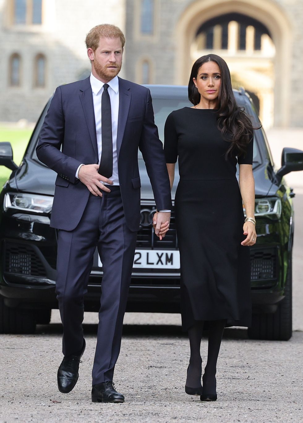 prince harry and meghan markle during the walkabout to greet wellwishers at ﻿windsor castle following the queen’s death in september 2022﻿