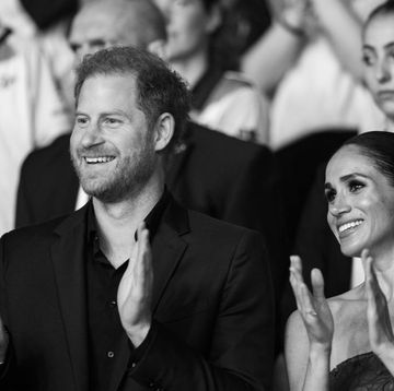prince harry and meghan markle at the invictus games in black and white