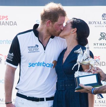 duchess meghan gives prince harry a sweet kiss
