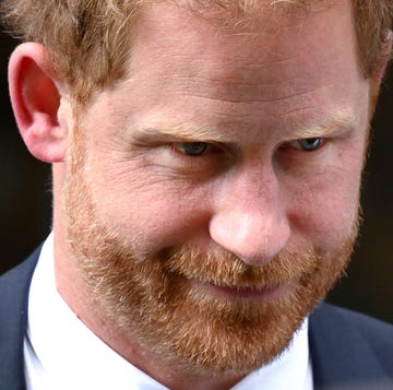 Prince Harry gives evidence at The Mirror Group Newspapers trial in June 2023 a close up of prince harry's face, looking off camera and appearing thoughtful, while wearing a blue suit