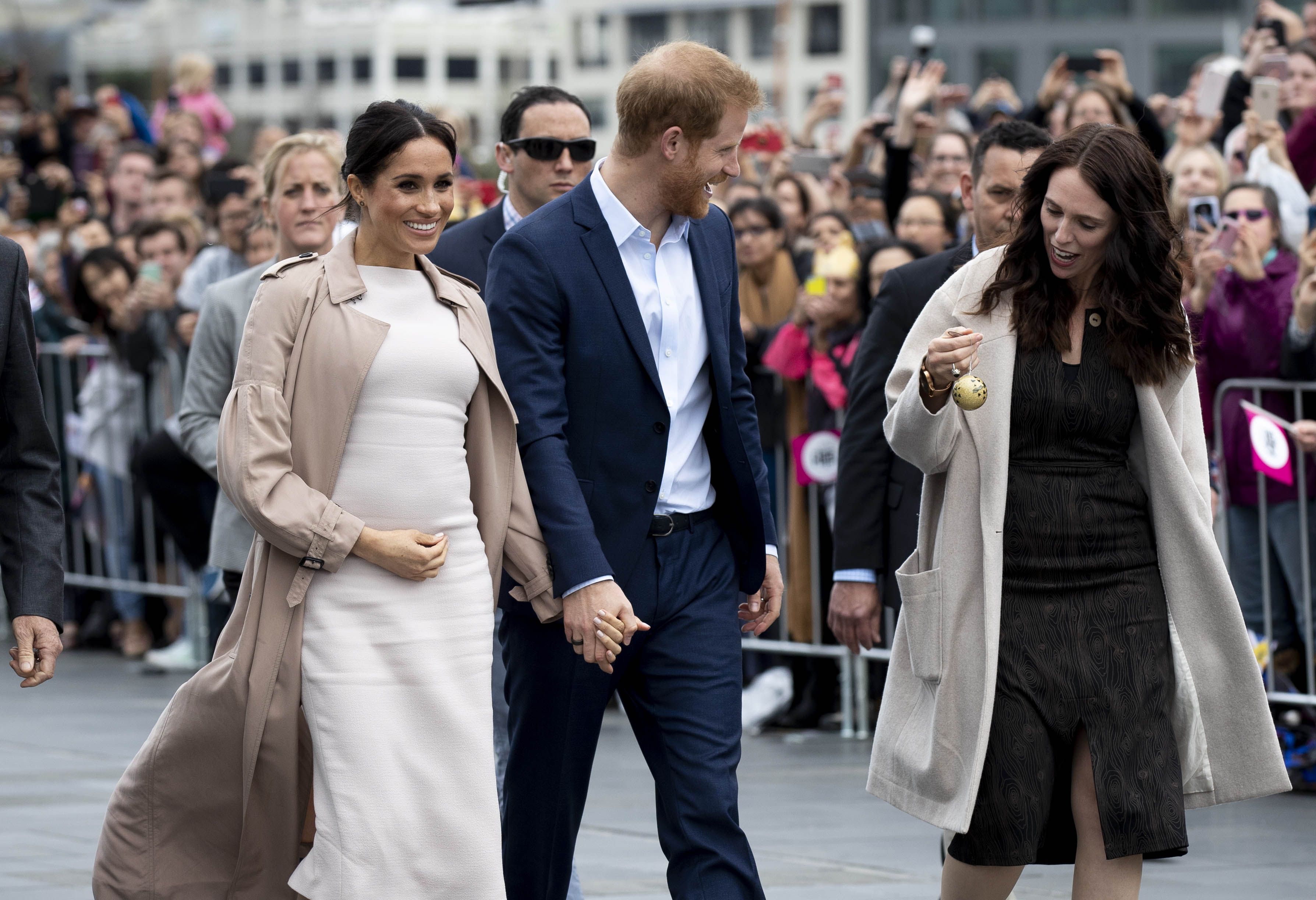 Meghan Markle Wears a Burberry Trench with Brandon Maxwell Dress