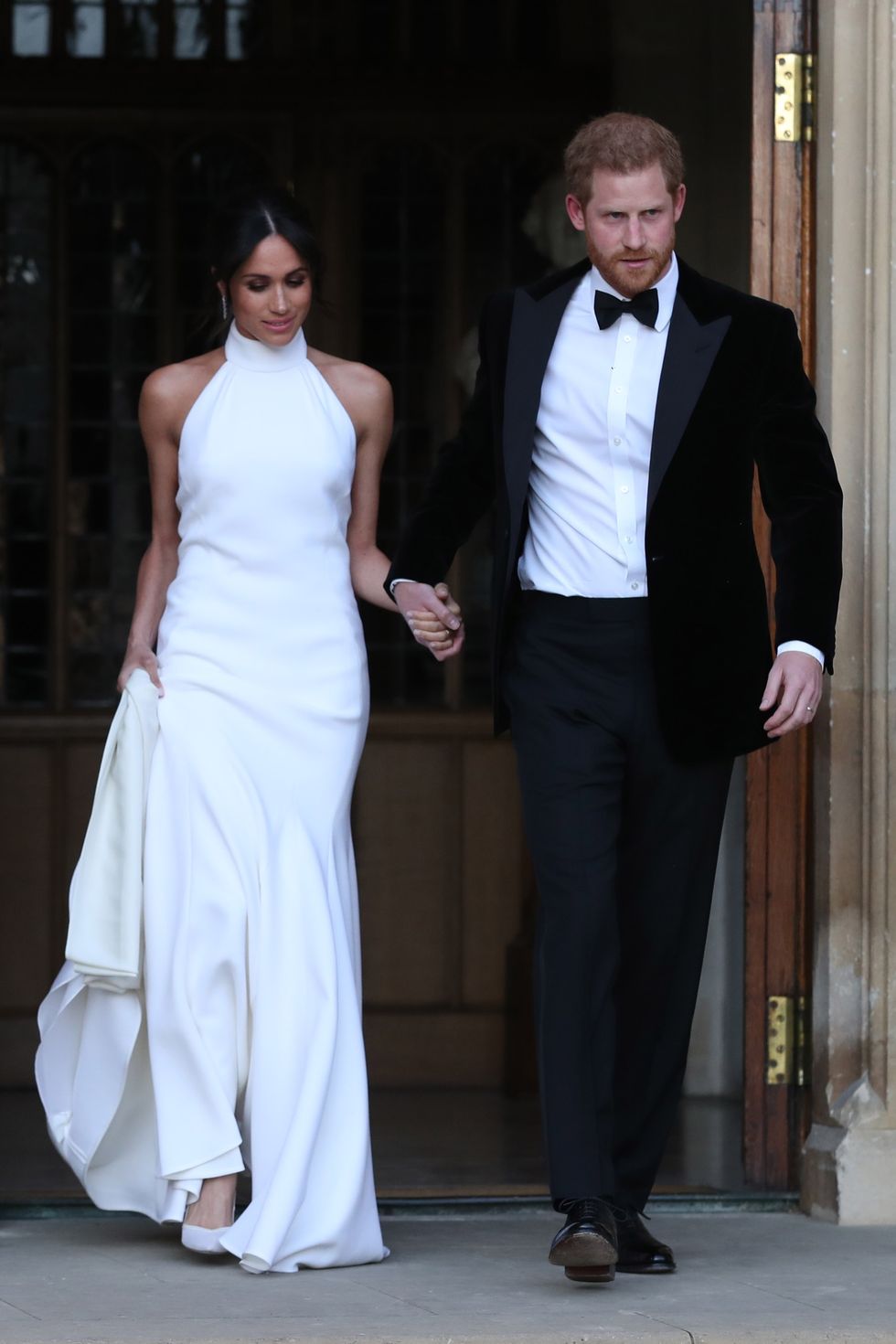 windsor, united kingdom   may 19 duchess of sussex and prince harry, duke of sussex leave windsor castle after their wedding to attend an evening reception at frogmore house, hosted by the prince of wales on may 19, 2018 in windsor, england photo by steve parsons   wpa poolgetty images
