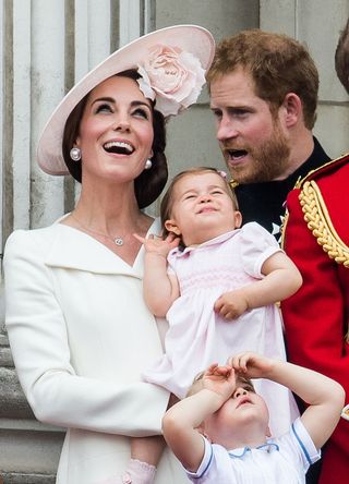 Prince Harry with Princess Charlotte and Prince George. 