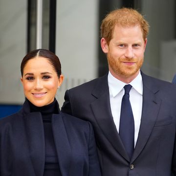 prince harry and meghan markle look smart in dark coloured outfits