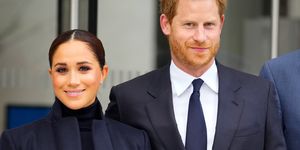 prince harry and meghan markle look smart in dark coloured outfits