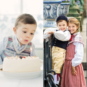 a group of children posing for a photo with a cake