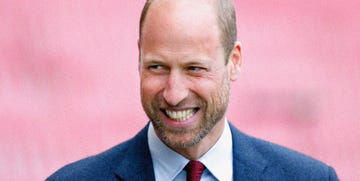 prince william in a suit against a pink background