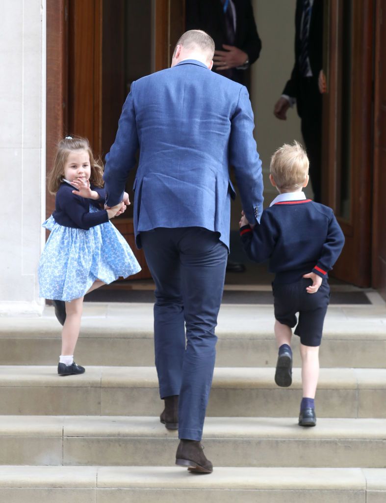 Princess Charlotte waves from steps of hospital on the way to meet new royal baby