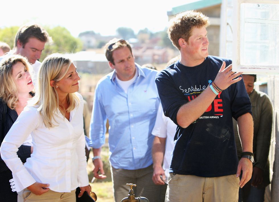 Prince Harry with journalists including Duncan Larcombe from The Sun in Lesotho
