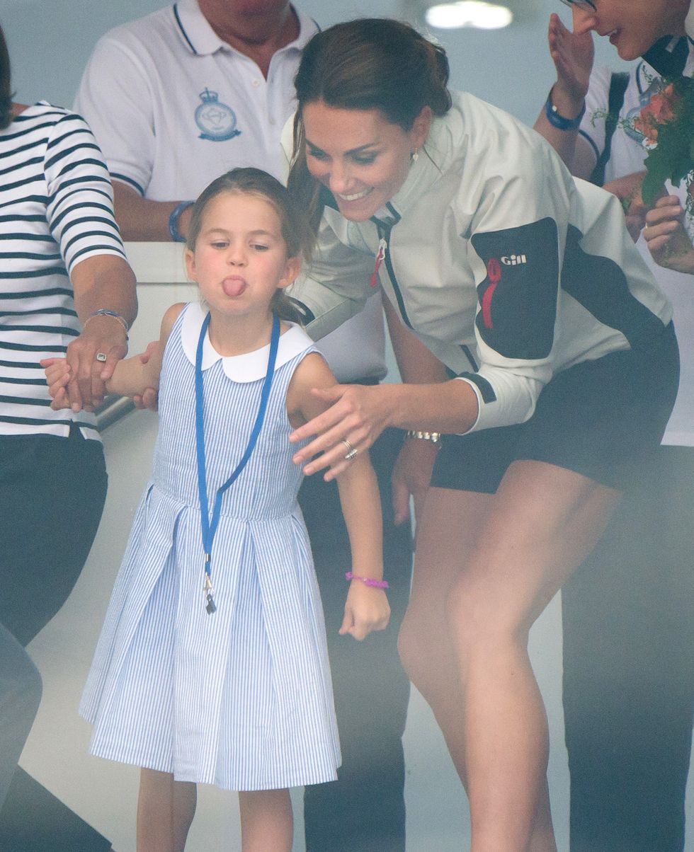 Princess charlotte sticks out tongue with mum kate middleton at sailing regatta
