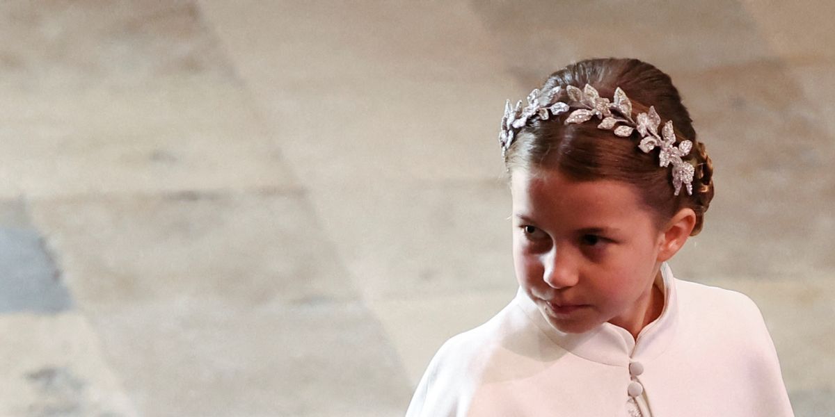 Princess Charlotte and Prince Louis hold hands at the coronation