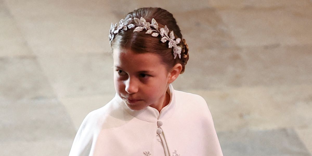 Princess Charlotte and Prince Louis hold hands at the coronation