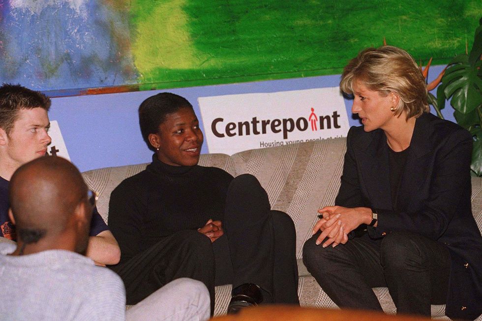 princess diana visits with three people at centrepoint charity in march 1997