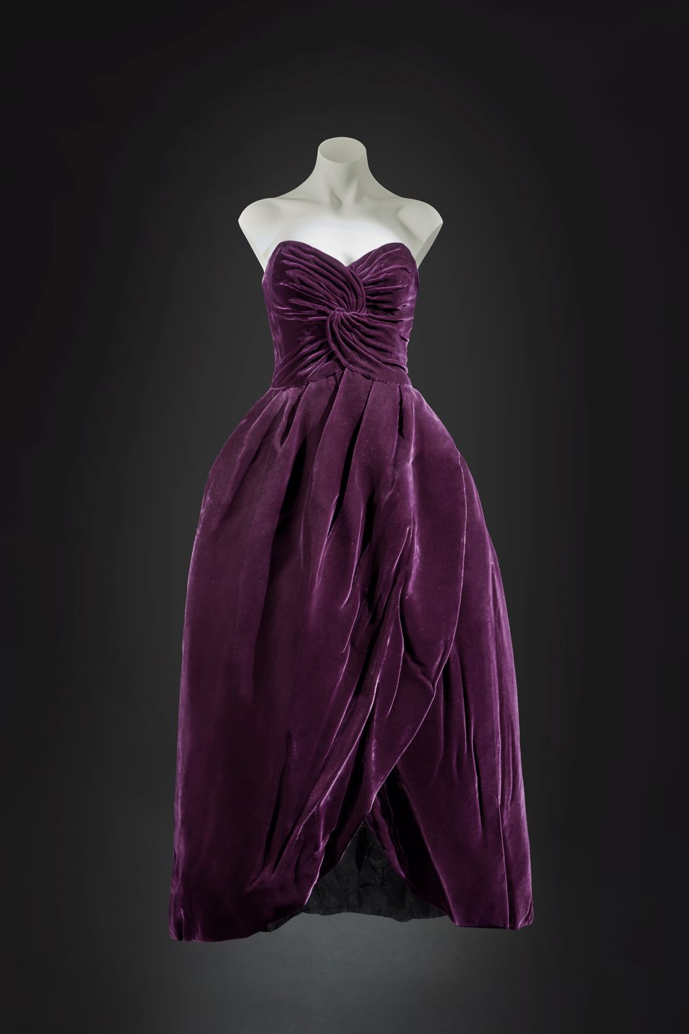 princess diana the ball dress of deep aubergine silk velvet with a tulipshaped stiffened skirt augmented by three paste buttons at the back﻿ was designed by society dressmaker victor edelstein