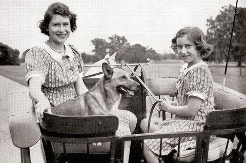 Princess Elizabeth, future Queen Elizabeth II, left, and Princess Margaret, right, driving a pony and trap in Great Windsor Park, England, 1941