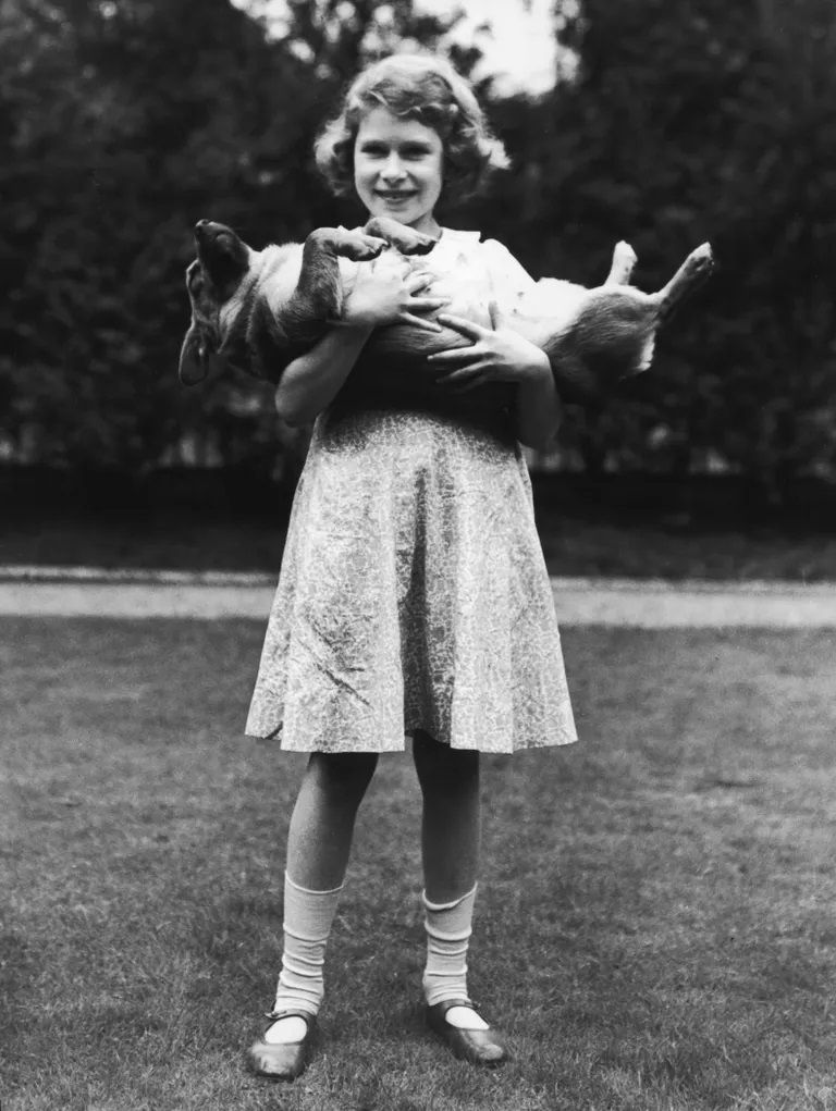 princess elizabeth holding a corgi dog, undated