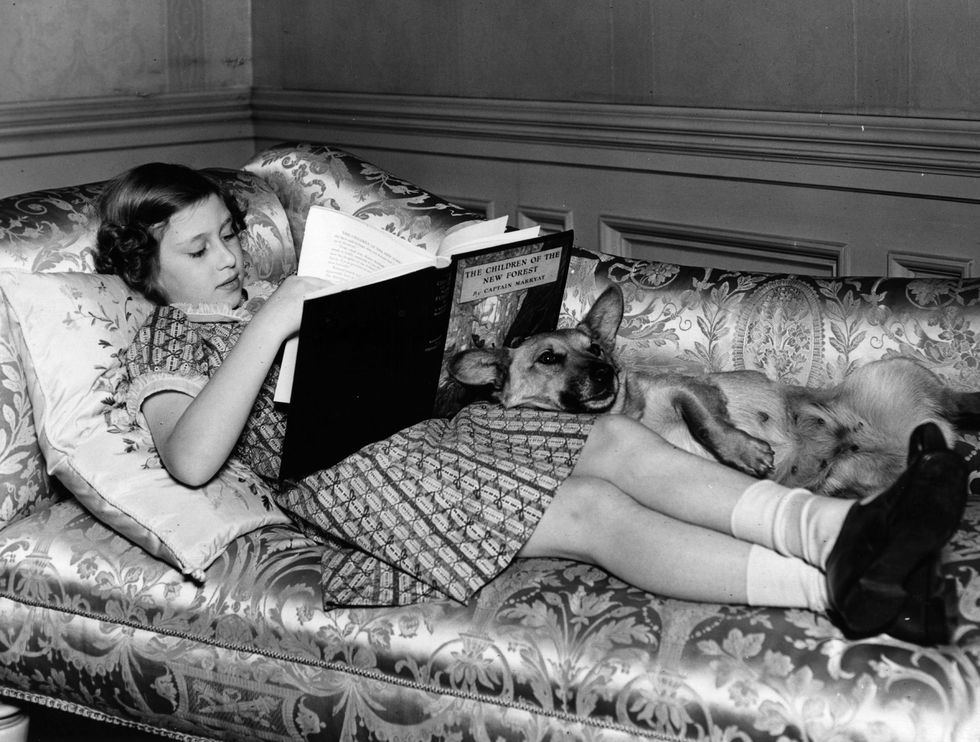 Elizabeth II Reading On Sofa