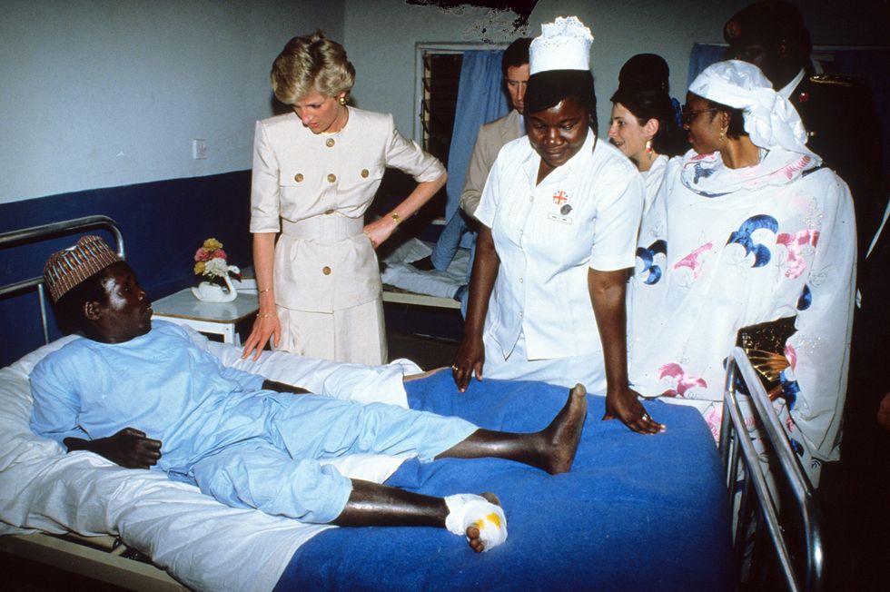 Princess Diana meets a patient during a hospital visit in Cameroon in March 1990