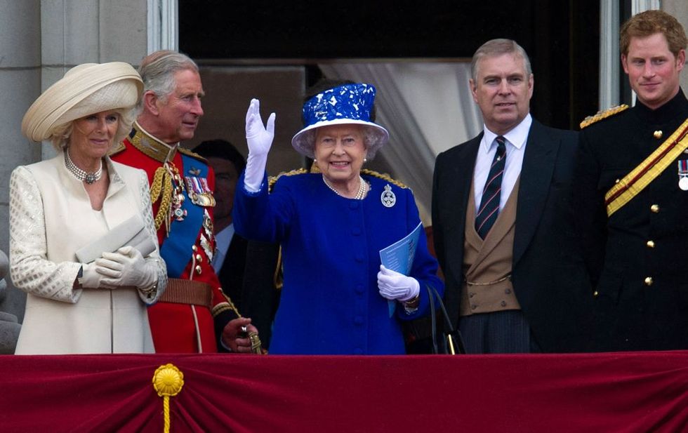 britains queen elizabeth ii c waves flanked by members of the british royal family l r camilla, duchess of cornwall, prince charles, prince of wales, prince andrew, duke of york and prince harry ahead of the fly past from the balcony of buckingham palace following the queens birthday parade, trooping the colour, in central london on june 15, 2013 the ceremony of trooping the colour is believed to have first been performed during the reign of king charles ii in 1748, it was decided that the parade would be used to mark the official birthday of the sovereign more than 600 guardsmen and cavalry make up the parade, a celebration of the sovereigns official birthday, although the queens actual birthday is on 21 april afp photo carl court photo by carl court afp photo by carl courtafp via getty images