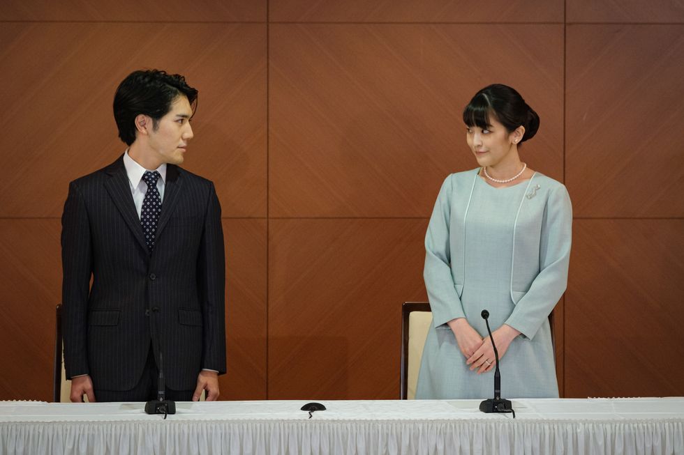 tokyo, japan   october 26 princess mako, the elder daughter of prince akishino and princess kiko, and her husband kei komuro, a university friend of princess mako, poses during a press conference to announce their wedding at grand arc hotel on october 26, 2021 in tokyo, japan princess mako married kei komuro today at a registry office following a relationship beset with controversy following the revelation that mr komuro’s mother was embroiled in a financial dispute with a former fiancé following the wedding, mako will renounce her royal entitlements and move with komuro to new york photo by nicolas datiche   poolgetty images